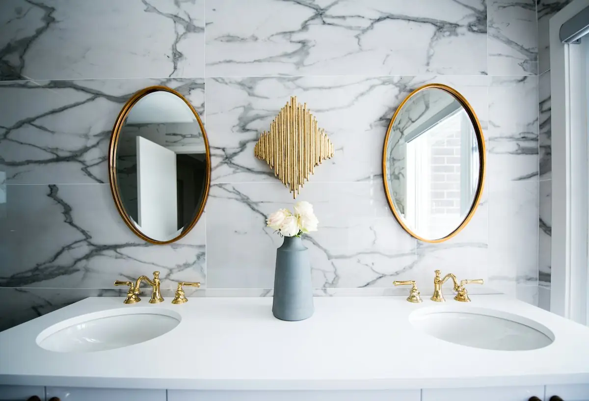 Double vanity with marble-effect tiled wall